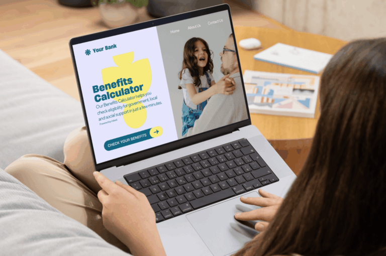 Person using a laptop showing a banking website with a Benefits Calculator and a “Check your benefits” button.
